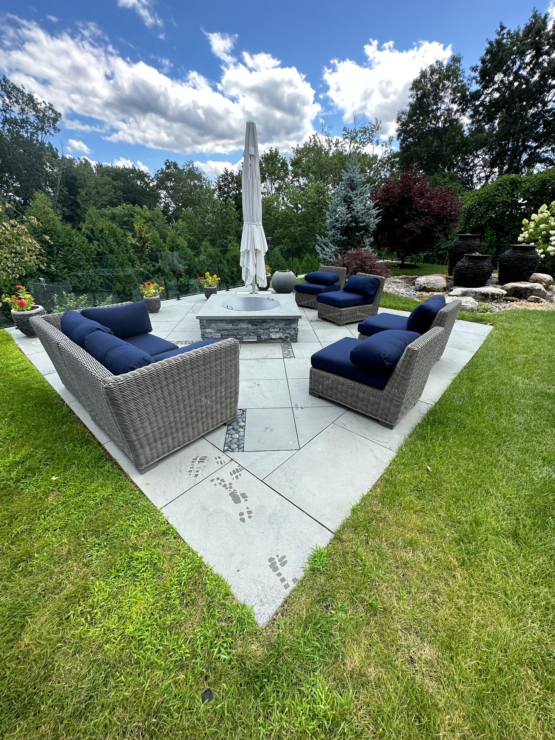 Paver patio with modern fire feature and outdoor seating