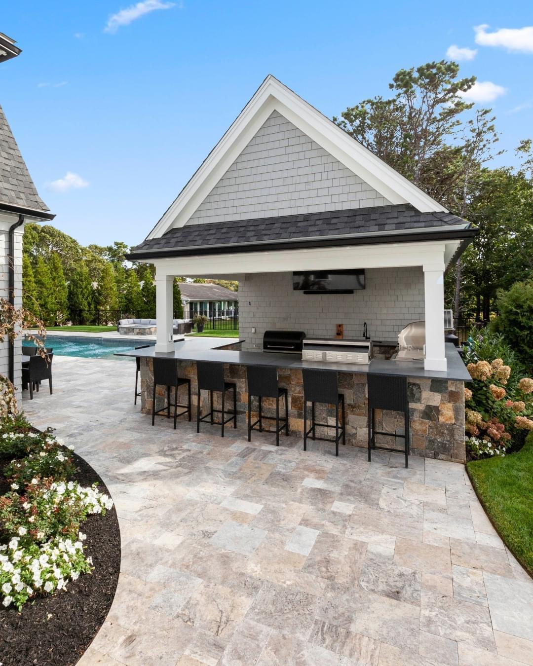 Outdoor living space with fire pit and paver patio